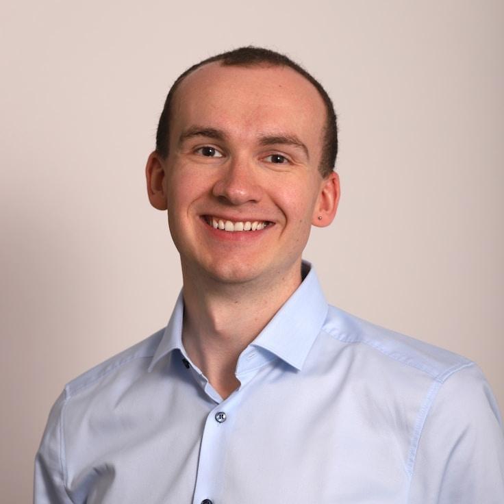 Kaveri Mehta, Lead Design Curator at CircleEmberMirror, reviewing corporate floral arrangements